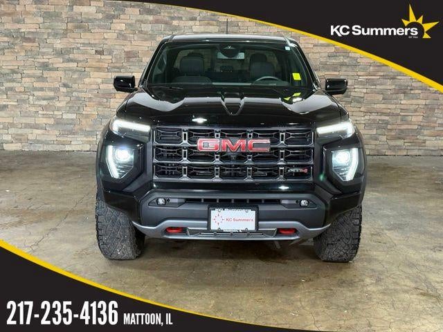 2023 GMC Canyon Crew Cab Short Box 4-Wheel Drive AT4 in Onyx Black — front three-quarter view